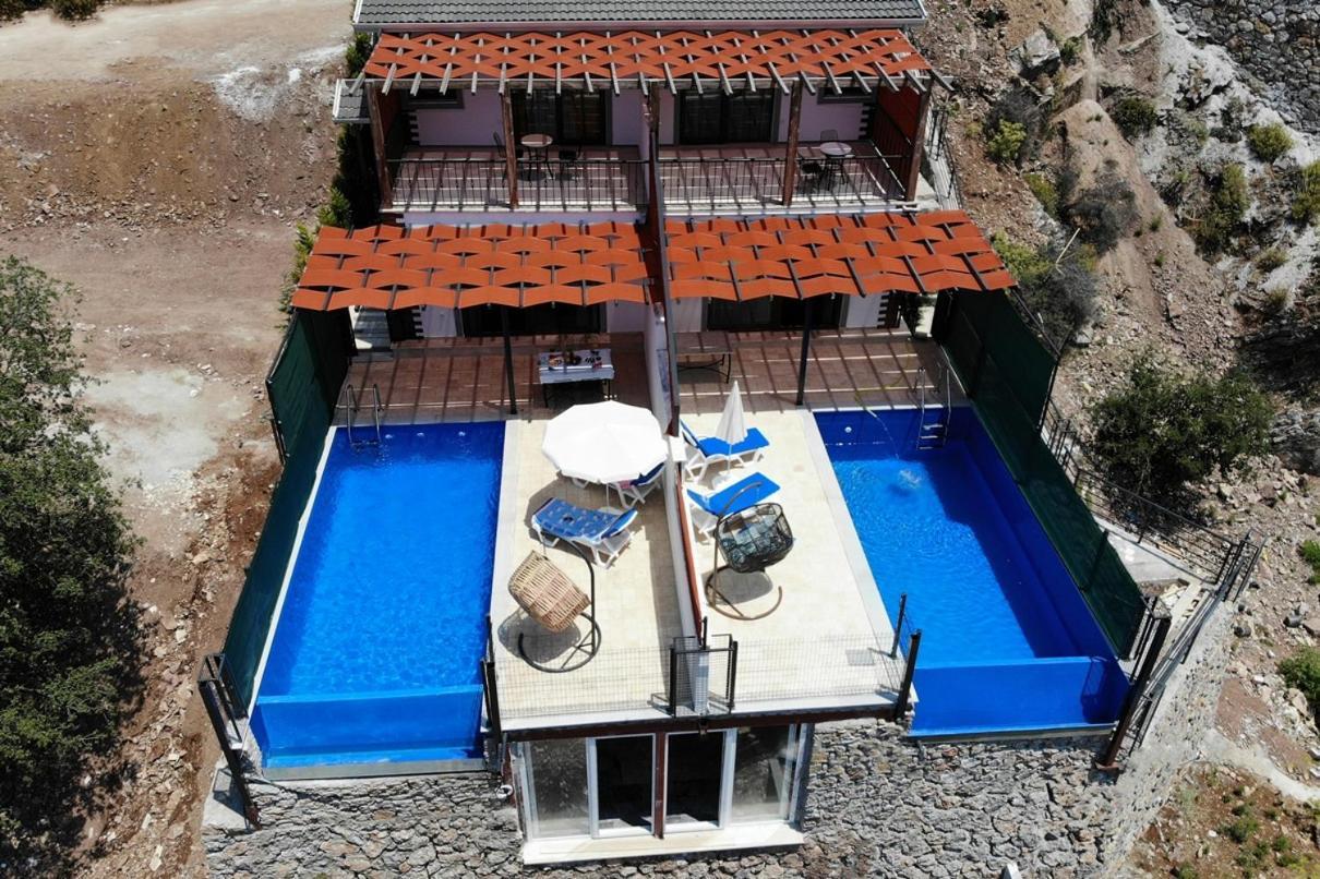 Vera Faralya Kirme Deniz Manzarali Korunakli Balayi Villasi Fethiye